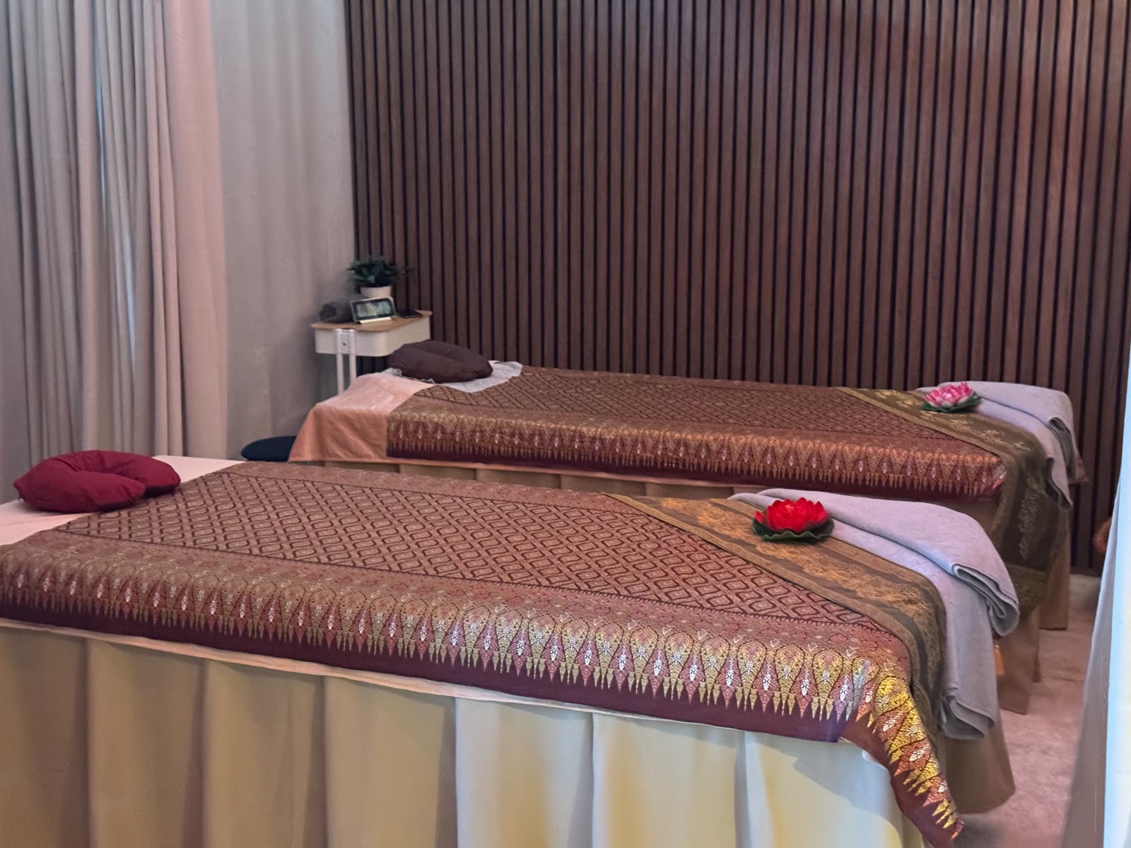 Siam Spa treatment room with two traditional Thai massage tables